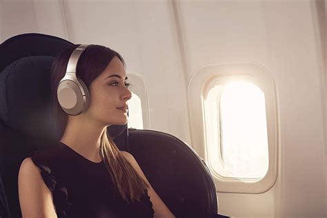 can u listen to music on a plane without headphones?